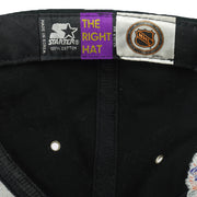 Black Starter label beside an orange NHL shield inside the Detroit Red Wings cap