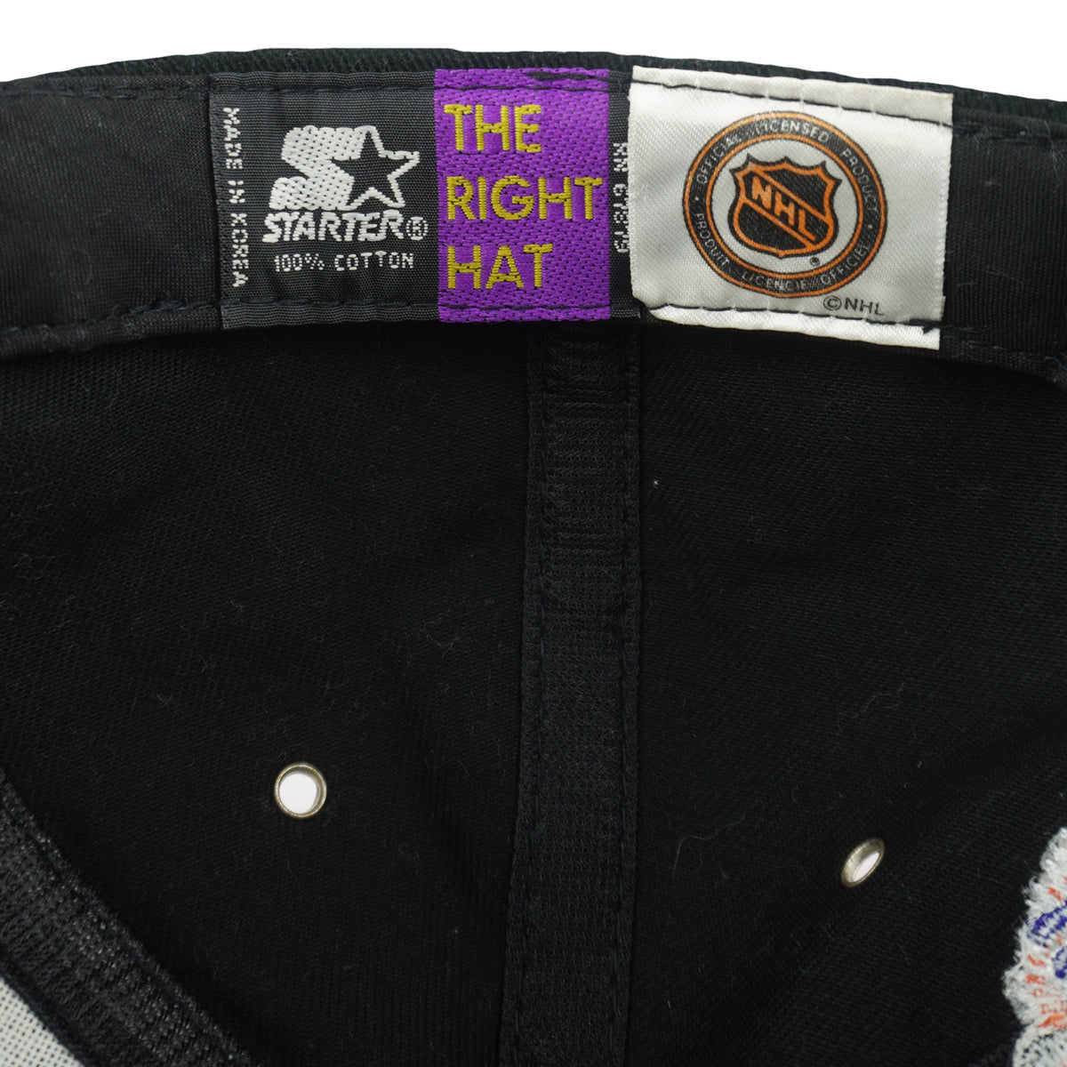 Black Starter label beside an orange NHL shield inside the Detroit Red Wings cap