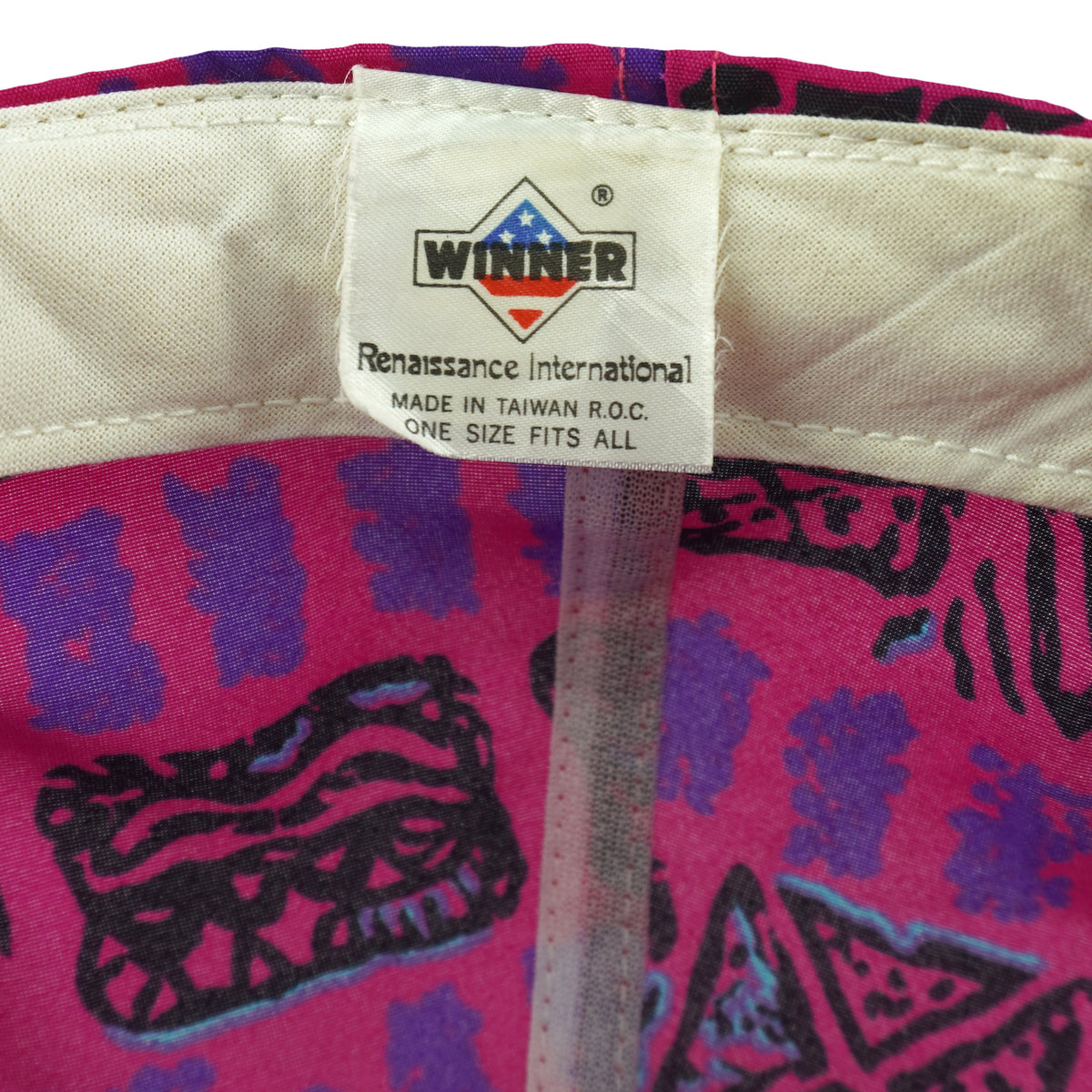 Maker and size label close-up of the pink, purple, and black Crandon Wisconsin fishing rope snapback hat