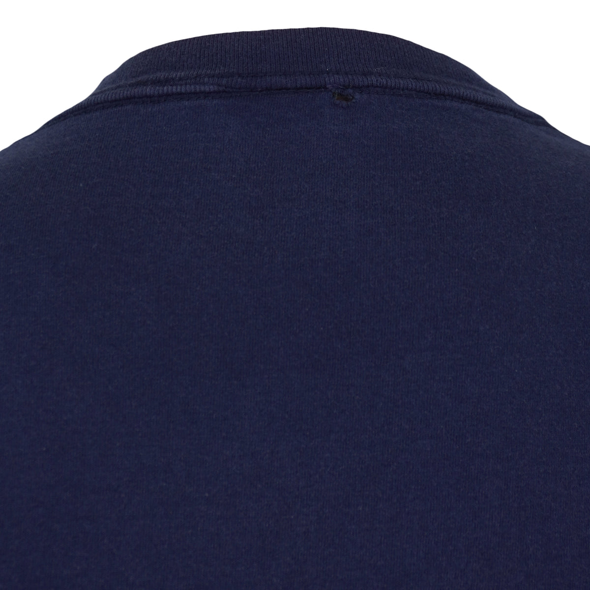 Small hole below the back neckline of the navy Houston Astros T-shirt