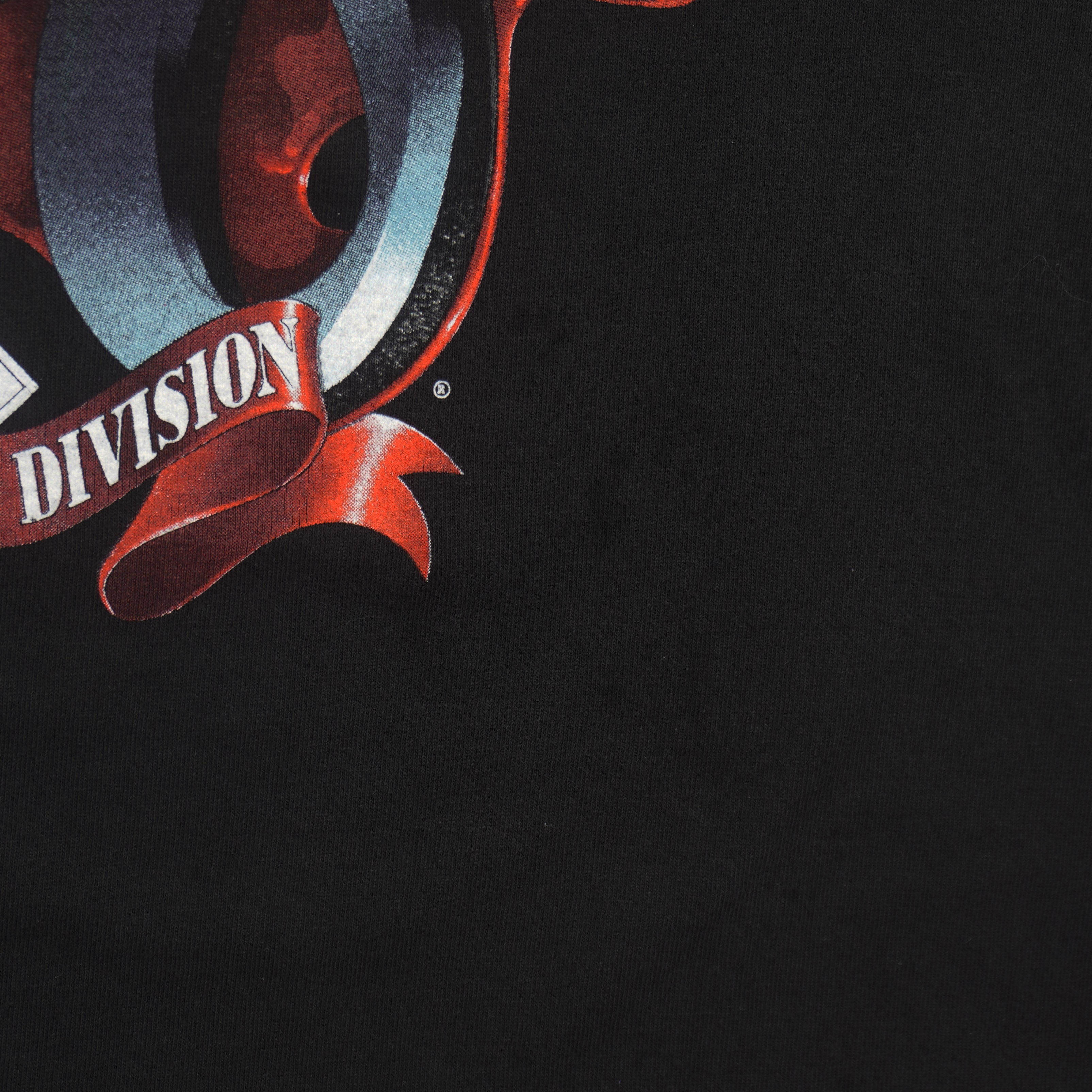 Close view of collar and print detail on the black St. Louis Cardinals 1993 Central Division t-shirt