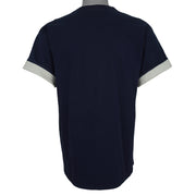 Plain back of the navy Astros T-shirt with gray fabric visible at rolled sleeves