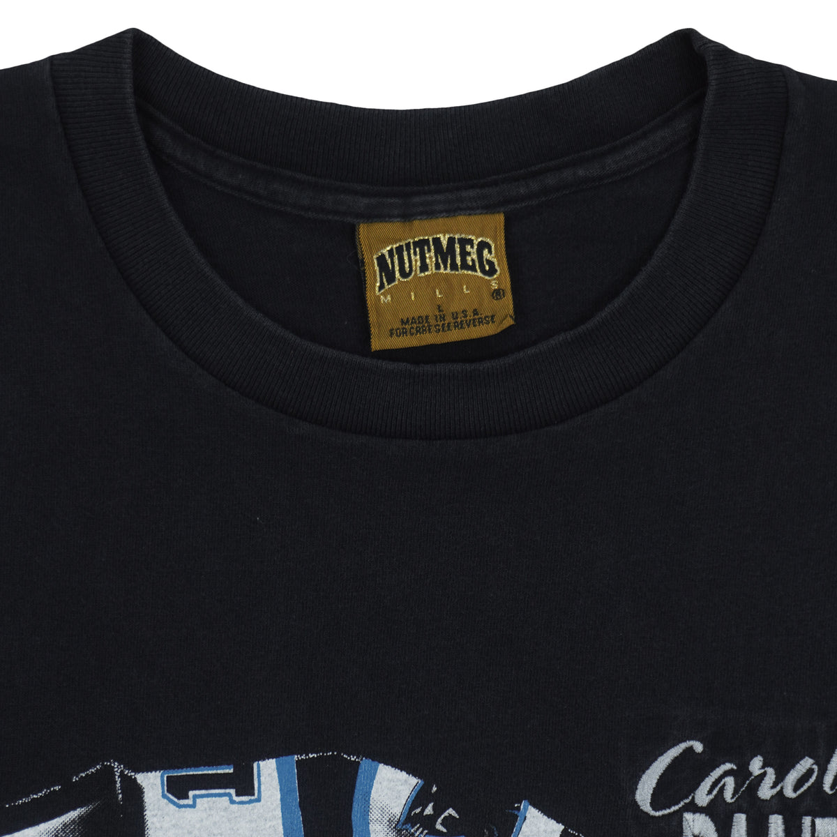 Close view of the Nutmeg Mills label inside the black Carolina Panthers 1993 Player Collage t-shirt