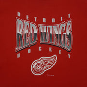 Close view of print and collar detail on the red Detroit Red Wings Logo sweatshirt