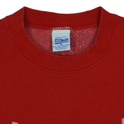 Close view of the Salem Sportswear label inside the red Detroit Red Wings Logo sweatshirt