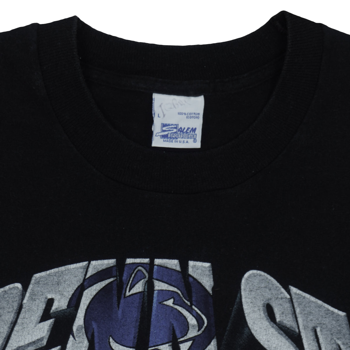Close view of the Salem Sportswear label inside the black Penn State Rose Bowl t-shirt