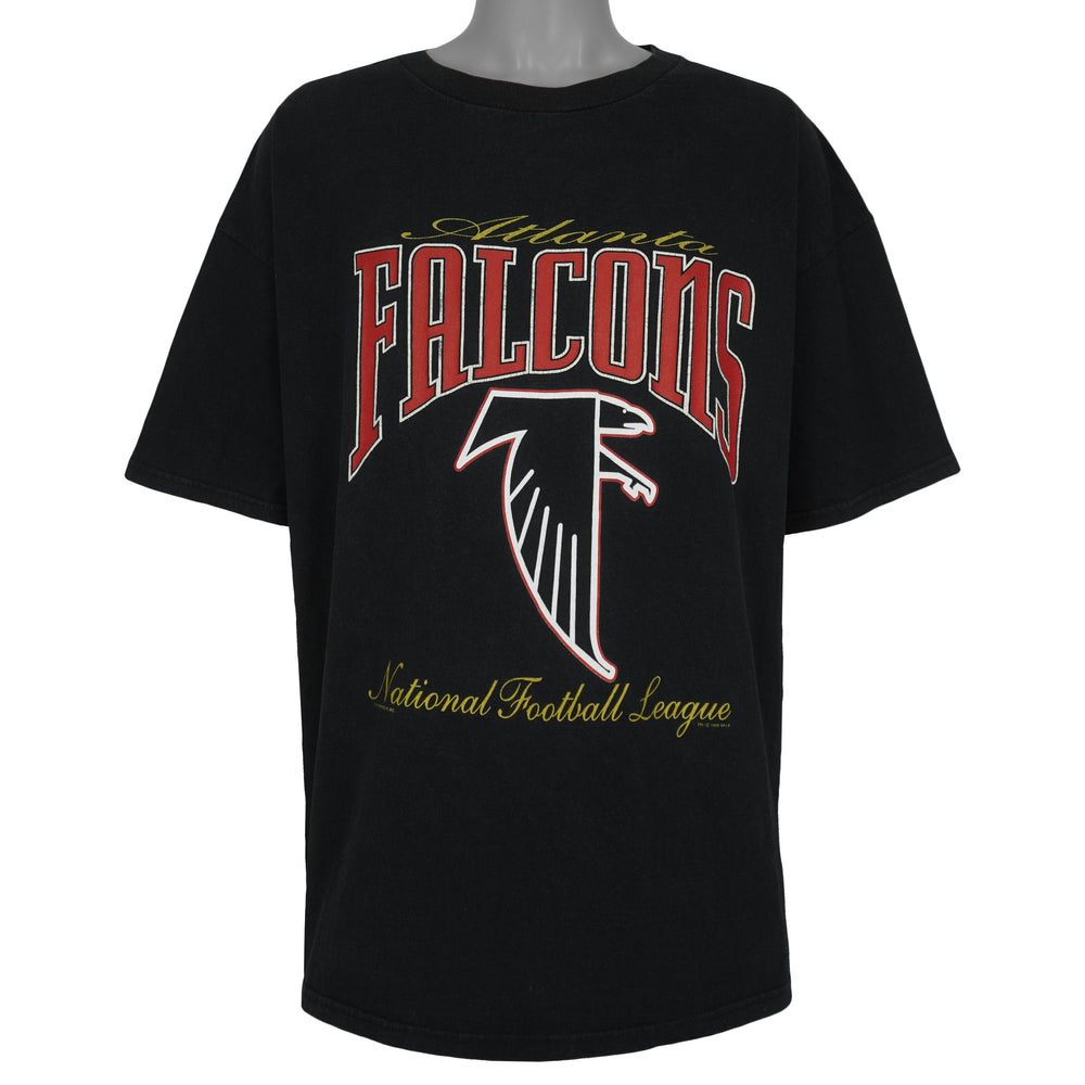 Front view of the black 1999 NFL Atlanta Falcons t-shirt with a large team logo graphic