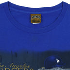 Nutmeg neck label close-up of the blue Los Angeles Dodgers locker-room graphic T-shirt