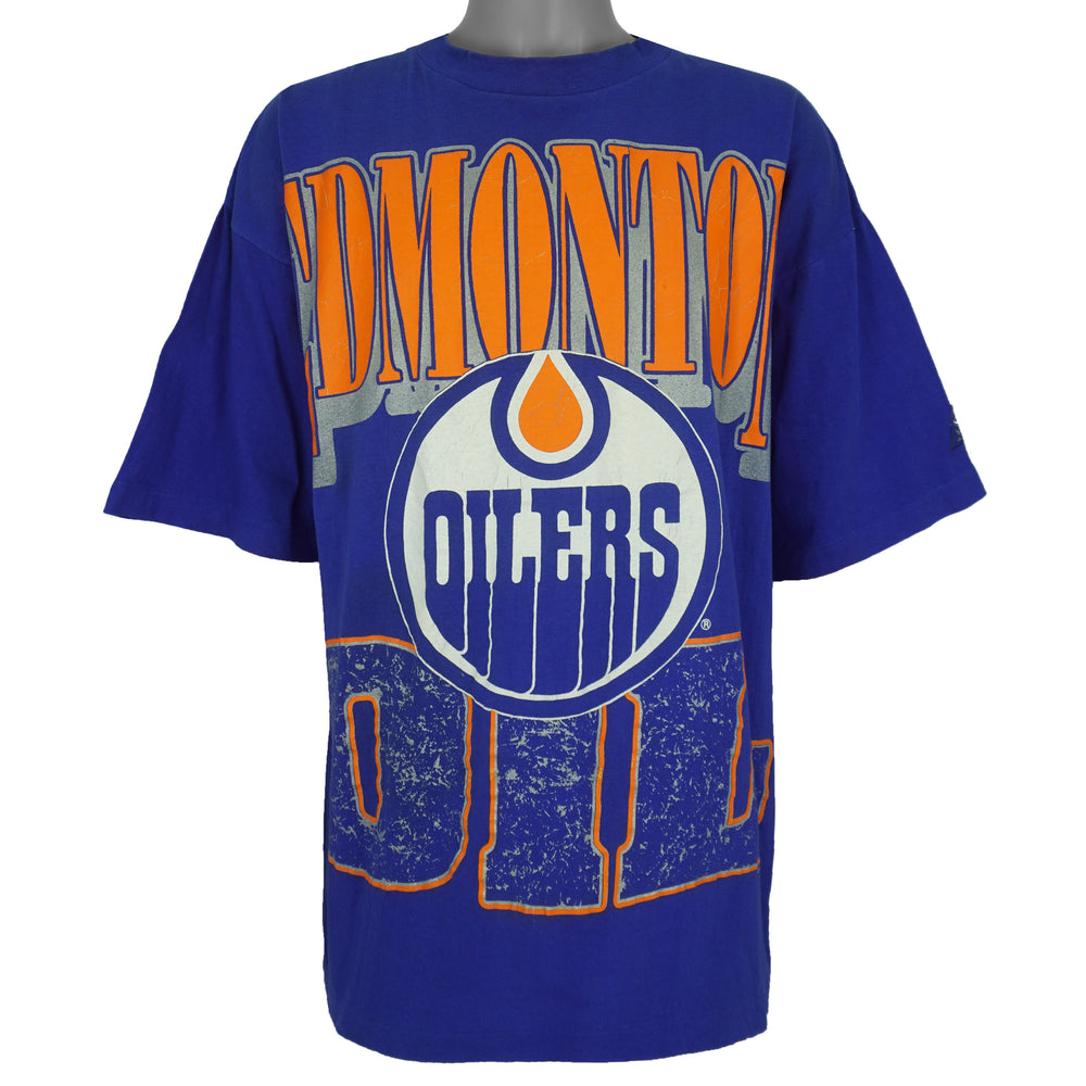 Full front view of the blue Edmonton Oilers T-shirt with large orange and white logo print