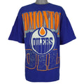 Full front view of the blue Edmonton Oilers T-shirt with large orange and white logo print