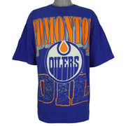 Full front view of the blue Edmonton Oilers T-shirt with large orange and white logo print