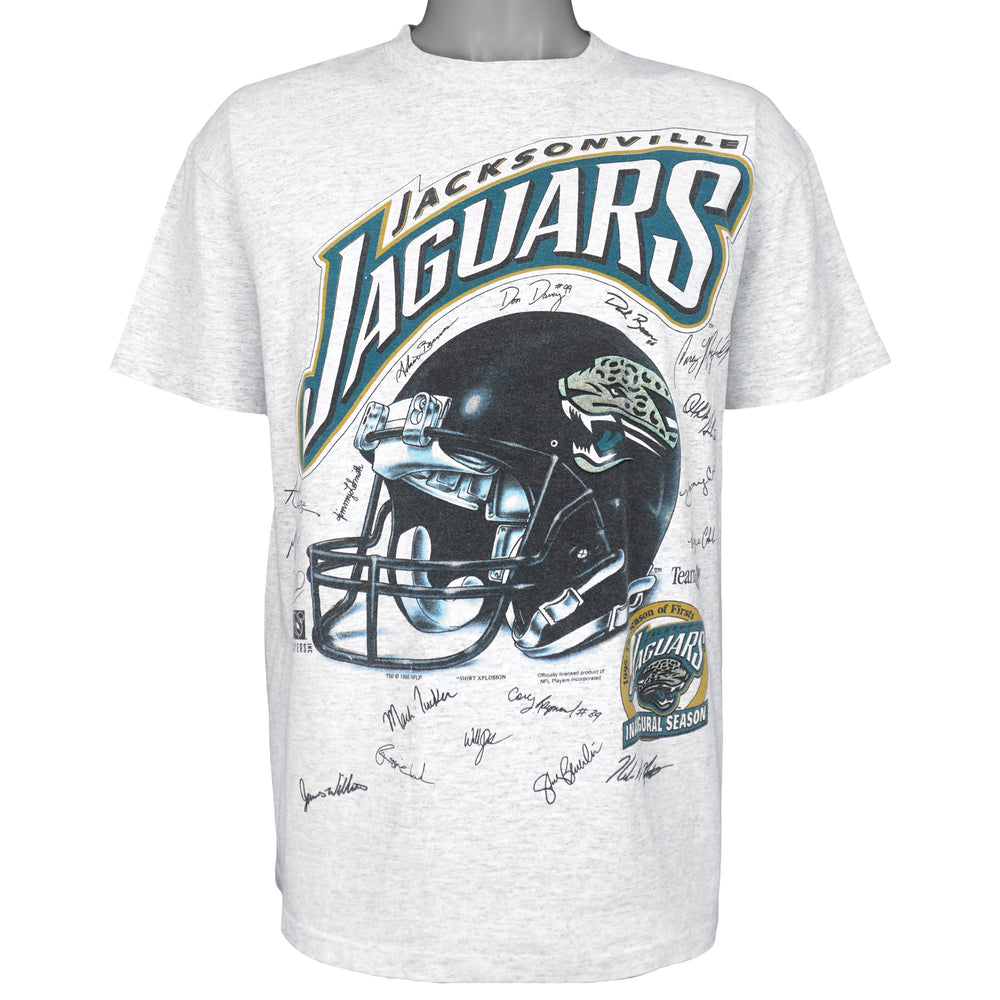 Full front view of the gray Jacksonville Jaguars inaugural season T-shirt with helmet and player signatures
