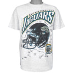 Full front view of the gray Jacksonville Jaguars inaugural season T-shirt with helmet and player signatures