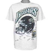Full front view of the gray Jacksonville Jaguars inaugural season T-shirt with helmet and player signatures