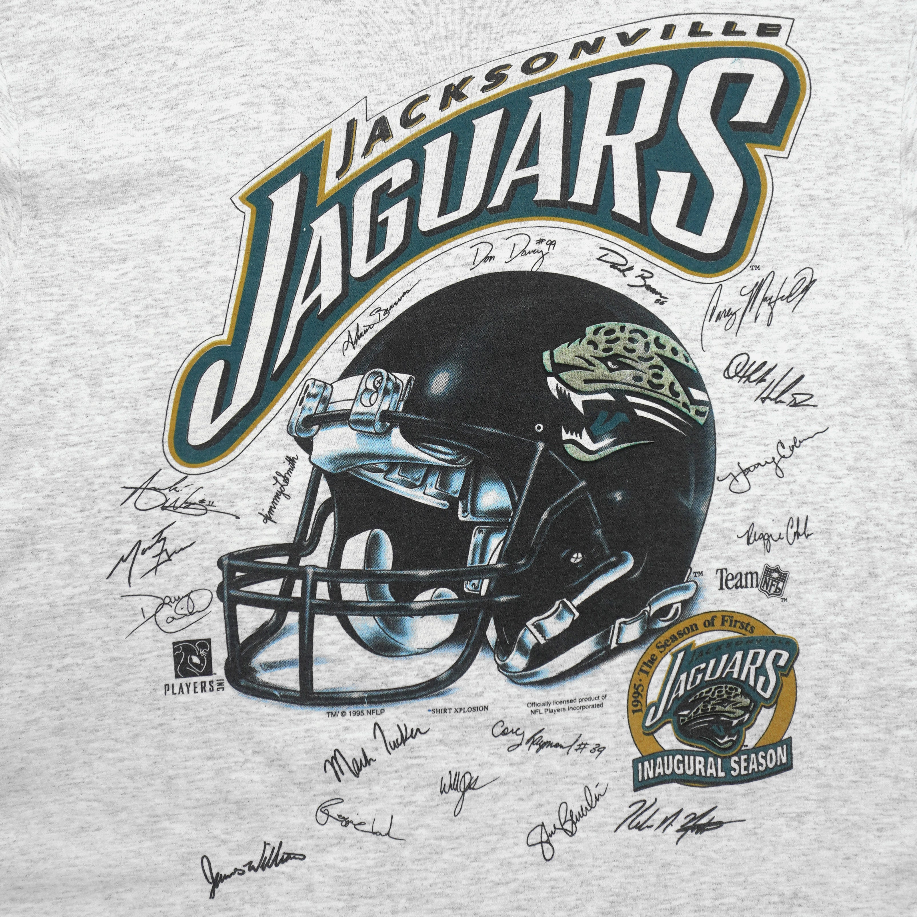 Close-up of the Jacksonville Jaguars helmet graphic, inaugural season logo, and player signatures