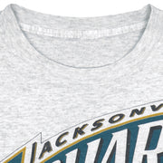 Neck label close-up of the gray Jacksonville Jaguars inaugural season T-shirt