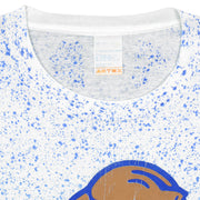 Close-up of the white BYU T-shirt neckline with blue speckled print and a white maker label