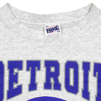 Neck and maker label close-up of the gray Detroit Lions football graphic T-shirt