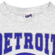 Neck and maker label close-up of the gray Detroit Lions football graphic T-shirt
