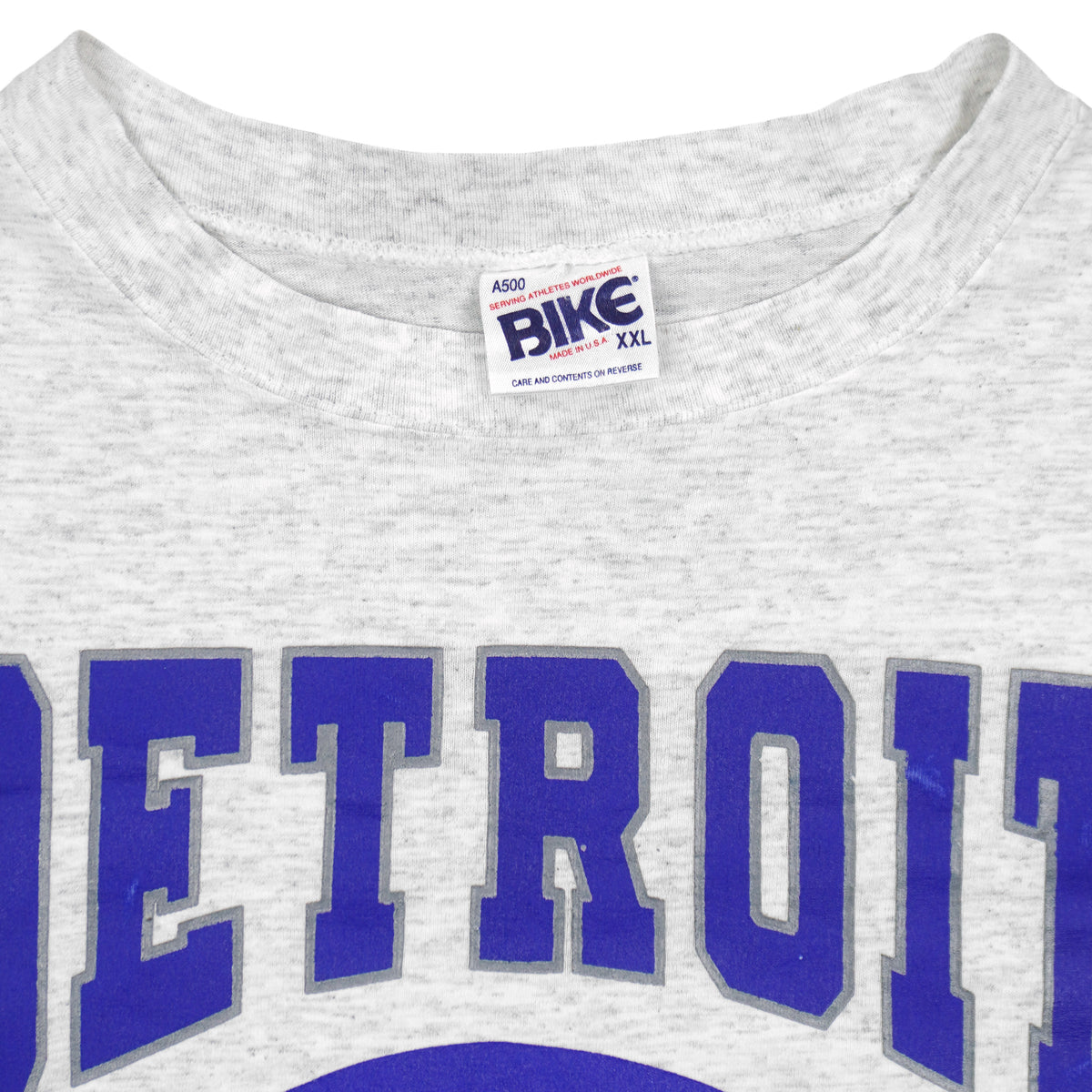 Neck and maker label close-up of the gray Detroit Lions football graphic T-shirt