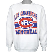 White sweatshirt with large red and blue Montreal Canadiens emblem