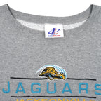 Neck and maker label close-up of the gray Jacksonville Jaguars embroidered logo sweatshirt