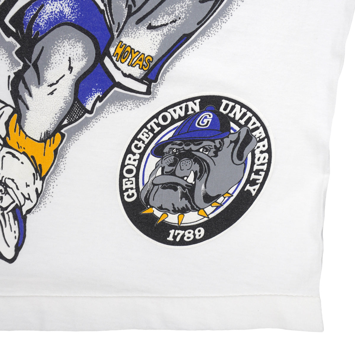 White Georgetown Hoyas T-shirt with round dog seal beside the mascot graphic