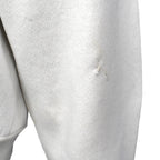 Repaired sleeve area close-up of the gray Tennessee Vols bear graphic sweatshirt