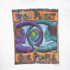 Close view of globe and faces graphic on the white One Planet One People globe short sleeve graphic T-shirt