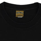 Close view of Nutmeg size label on the black Oregon Ducks 1995 Rose Bowl football short sleeve graphic T-shirt