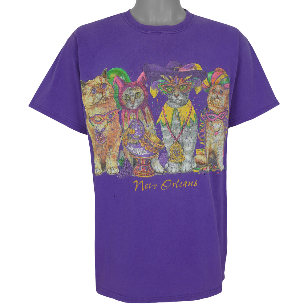 Purple New Orleans T-shirt front with colorful Mardi Gras cats and gold lettering