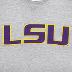 Close view of the purple LSU chest lettering with yellow outline