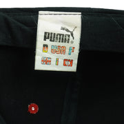 Puma woven label inside the black adjustable snapback cap
