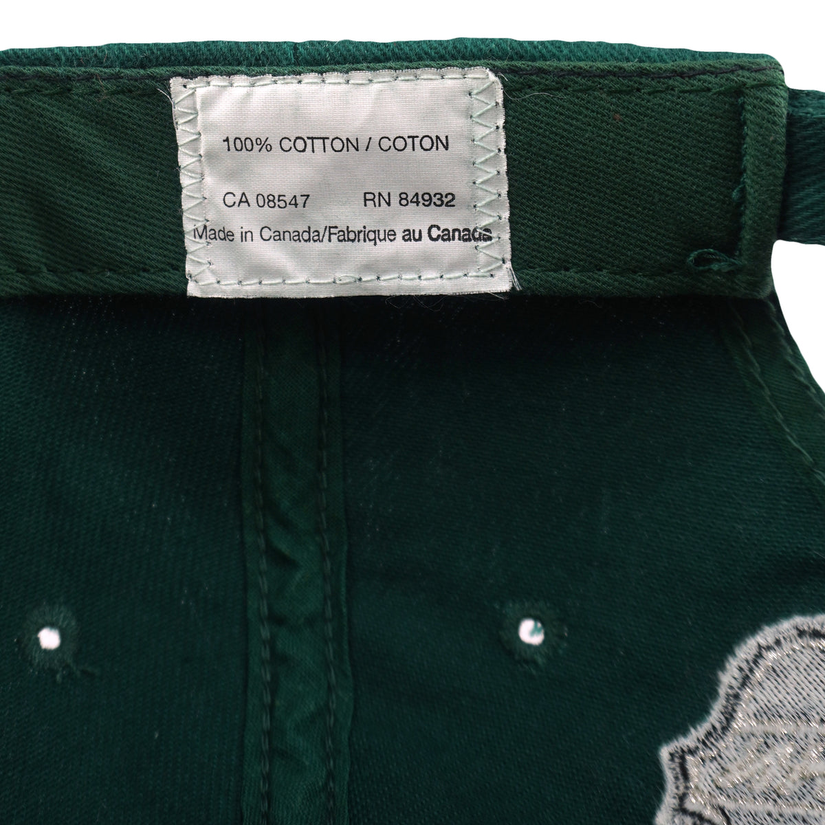 Cotton care label inside the green Minnesota Wild cap