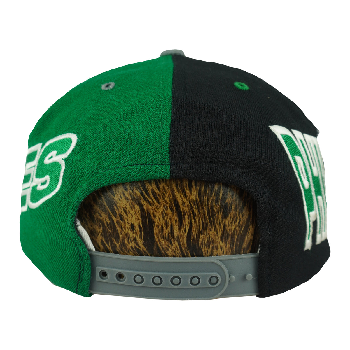 Split black and green cap rear with gray snap closure on the Philadelphia Eagles cap