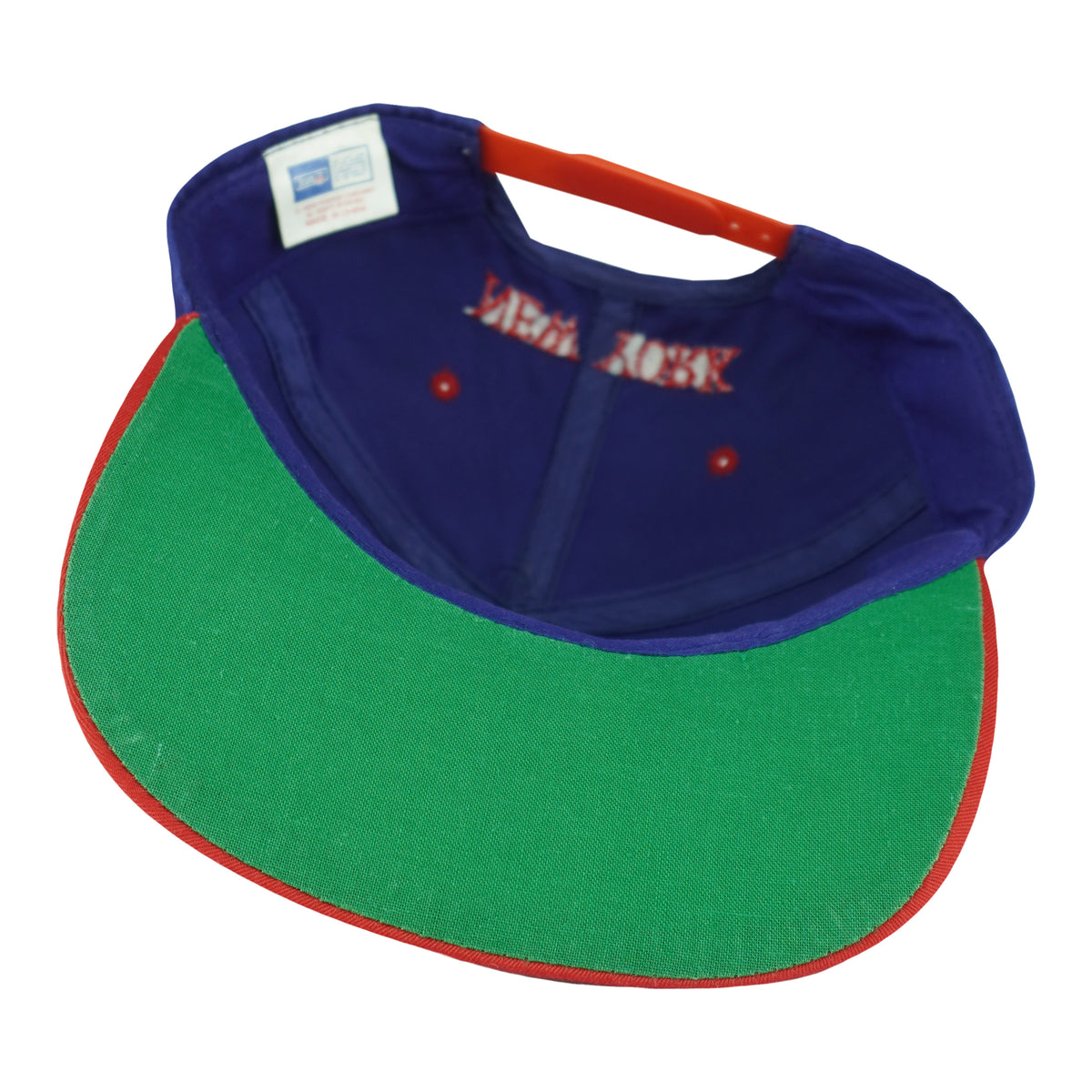 Interior view of the Giants snapback with green underbrim and red adjustable closure