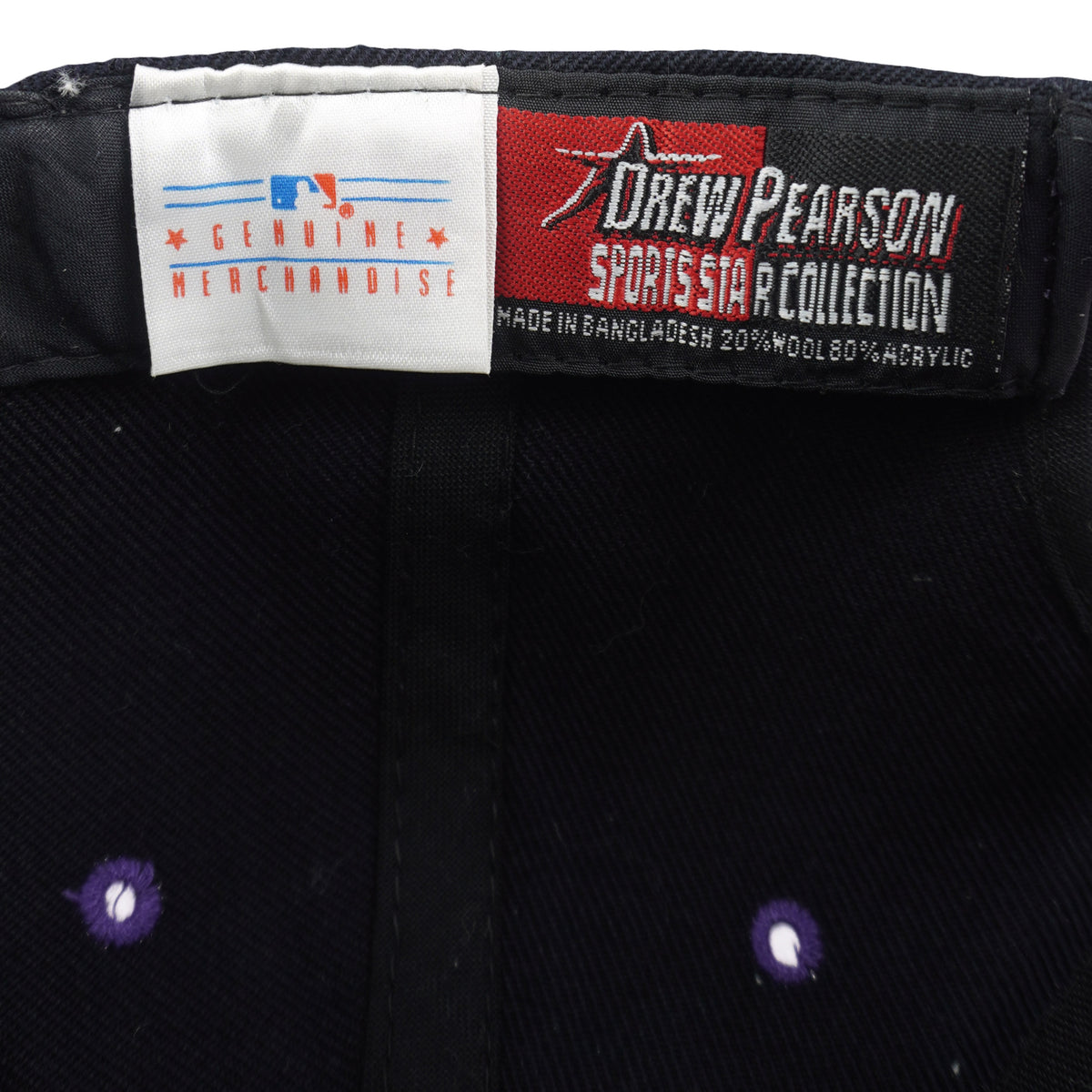 Close-up of the MLB and Drew Pearson Sports Headwear woven label set inside the cap