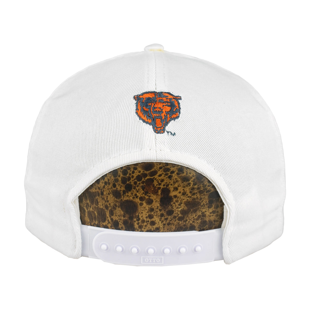 Rear of the white Chicago Bears cap with embroidered bear mascot and snap closure