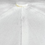 Close-up of the white Bears cap crown seam and woven fabric surface