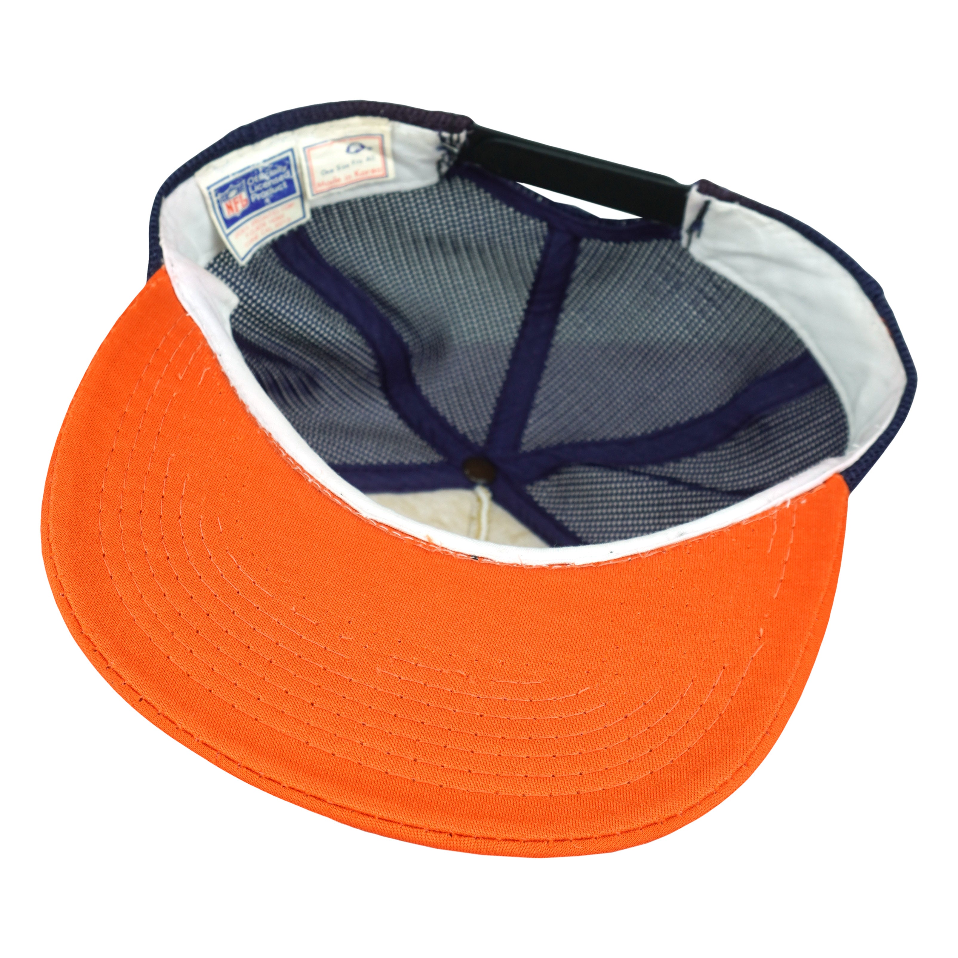Interior view of Bears trucker cap showing orange brim underside and sweatband