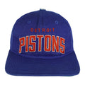 Royal blue and green 1990s NBA Starter Detroit Pistons snapback cap shown from the front