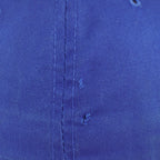 Close view of a small tear in the royal blue crown of the Pistons cap