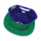 Interior of the Detroit Pistons cap showing black markings across the green underbrim