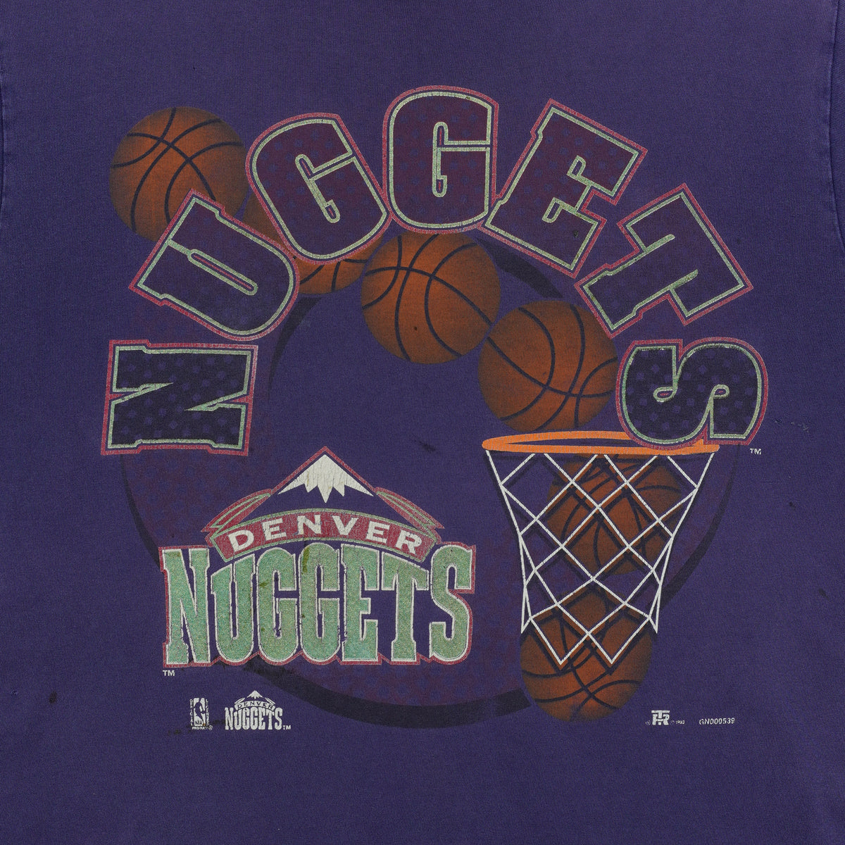 Close-up of the faded Denver Nuggets basketball-and-hoop front graphic