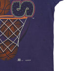 Close-up of small holes and marks beside the right edge of the Nuggets graphic