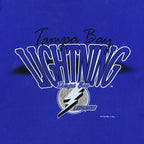 Close-up of the worn Tampa Bay Lightning graphic with a dark mark at the left edge