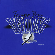 Close-up of the worn Tampa Bay Lightning graphic with a dark mark at the left edge