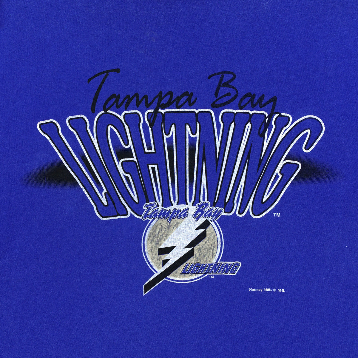 Close-up of the worn Tampa Bay Lightning graphic with a dark mark at the left edge