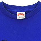 Close-up of the Nutmeg Mills XL Made in USA neck label