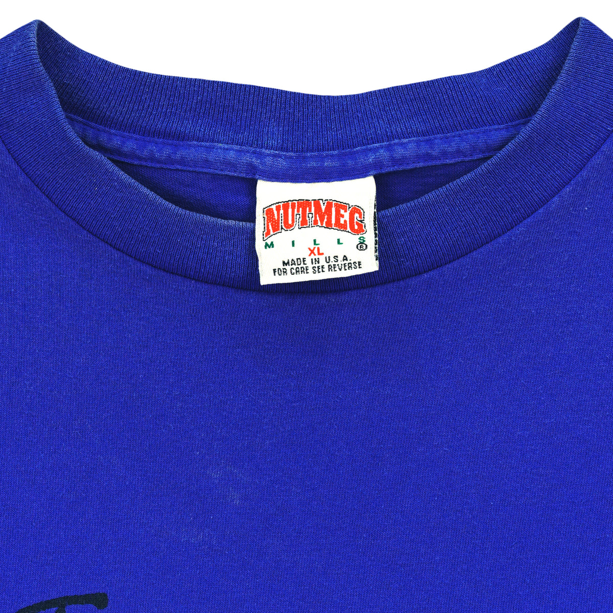 Close-up of the Nutmeg Mills XL Made in USA neck label